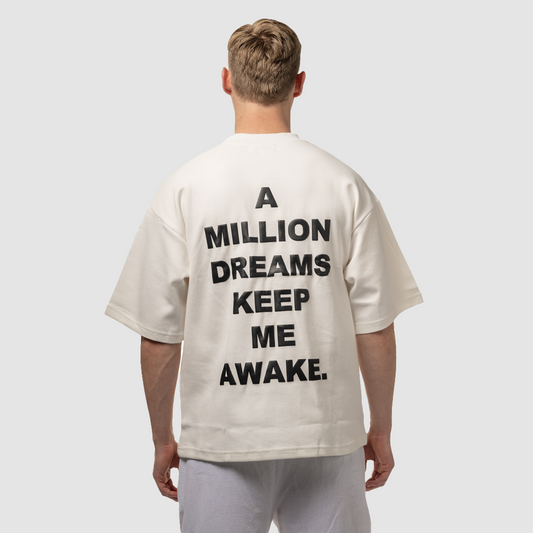 white oversized LIVINA streetwear t-shirt with back print quote | a million dreams keep me awake.