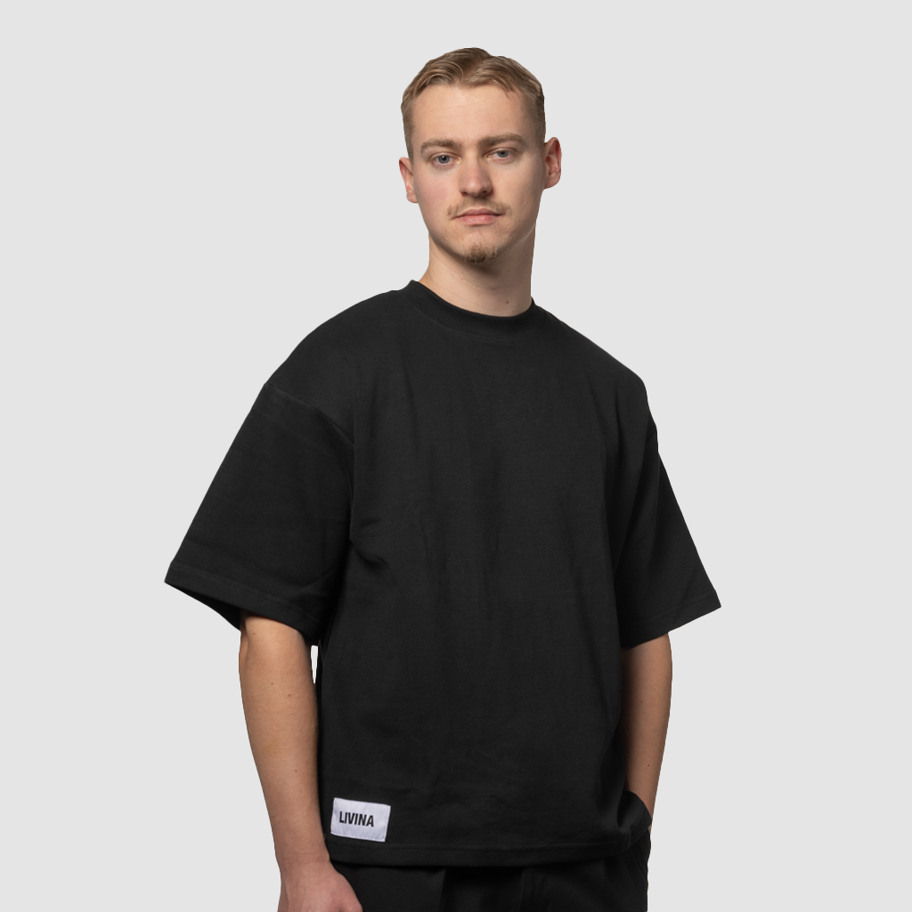 black oversized unisex quote t-shirt LIVINA male front view